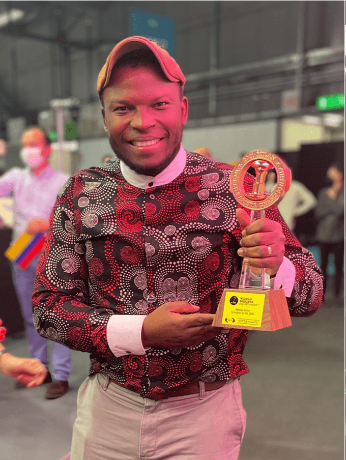 Martin Shabaya holding the World Barista Championship Fifth Place trophy, Milan 2021